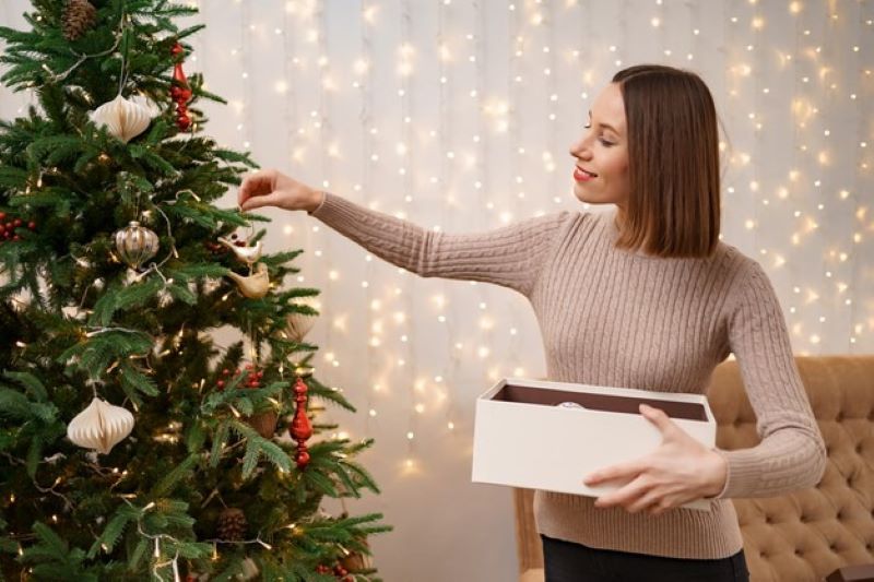 young girl decorating christmas